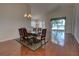 Open-concept living space with a dining area, and hardwood floors at 781 Lakeworth Cir, Lake Mary, FL 32746