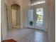 Inviting foyer with tiled flooring, and double door front entry at 781 Lakeworth Cir, Lake Mary, FL 32746