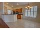 Eat in kitchen with stainless steel appliances, and white tile flooring at 781 Lakeworth Cir, Lake Mary, FL 32746