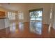 Bright living room with hardwood floors and lake view, open to the outside with a sliding glass door at 781 Lakeworth Cir, Lake Mary, FL 32746