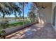 Relaxing screened patio with lake view and terracotta tile flooring, perfect for enjoying the outdoors at 781 Lakeworth Cir, Lake Mary, FL 32746