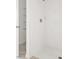 Sleek bathroom with a tiled shower, modern fixtures, and convenient built-in shelving at 792 Griffon Ave, Lake Alfred, FL 33850