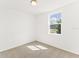 Cozy bedroom bathed in light from a large window; soft carpeting at 792 Griffon Ave, Lake Alfred, FL 33850