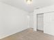 Light bedroom features closet storage; access to other rooms at 792 Griffon Ave, Lake Alfred, FL 33850