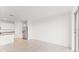 Open-concept living area with tile floors seamlessly connected to the modern kitchen at 792 Griffon Ave, Lake Alfred, FL 33850