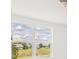 Bright interior view showing a large window with a scenic view of a home and landscape at 792 Griffon Ave, Lake Alfred, FL 33850