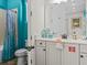 Nicely decorated bathroom featuring tiled shower with a wood-look shower curtain at 8086 Knee Deep Rd, Kissimmee, FL 34747