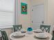 Charming dining space with white table and seating near a bright kitchen at 8086 Knee Deep Rd, Kissimmee, FL 34747