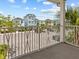 Exterior view from balcony overlooking street parking and the colorful beach homes at 8086 Knee Deep Rd, Kissimmee, FL 34747