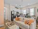 Open living area featuring modern decor, white kitchen and lots of natural light at 8086 Knee Deep Rd, Kissimmee, FL 34747