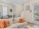 View of an open living area with a staircase, white walls and comfortable furnishings at 8086 Knee Deep Rd, Kissimmee, FL 34747