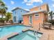 Private pool and spa, perfect for relaxation, with outdoor seating and colorful surroundings at 8086 Knee Deep Rd, Kissimmee, FL 34747