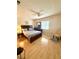 Bedroom features hardwood floors, a ceiling fan, and natural light at 9 Escondido Cir # 88, Altamonte Springs, FL 32701