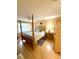 Bright bedroom features a four post bed, ceiling fan, and natural light at 9 Escondido Cir # 88, Altamonte Springs, FL 32701