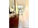 Elegant entryway with a decorative table, large mirror, and tiled flooring at 9 Escondido Cir # 88, Altamonte Springs, FL 32701