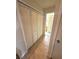 Hallway with closet provides passage in the interior of the home at 9 Escondido Cir # 88, Altamonte Springs, FL 32701