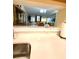 Kitchen counter with view into living and dining areas at 9 Escondido Cir # 88, Altamonte Springs, FL 32701