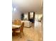Spacious open-concept living area with a brick fireplace and lots of natural light at 9 Escondido Cir # 88, Altamonte Springs, FL 32701
