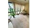 Inviting sunroom with carpet and large windows is a bright, airy space for relaxing at 9 Escondido Cir # 88, Altamonte Springs, FL 32701