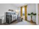 Charming Bedroom with a cozy crib, elephant plush toy, and soft yellow accents at 994 Lido Dr, Howey In The Hills, FL 34737