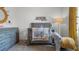 Adorable Bedroom with a gray crib, elephant plush, and stylish decorations at 994 Lido Dr, Howey In The Hills, FL 34737