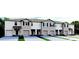 New townhome exterior featuring neutral paint, well-manicured landscaping, individual garages and stylish architectural details at 994 Lido Dr, Howey In The Hills, FL 34737