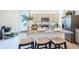 Modern kitchen features gray cabinets, granite counters, stainless appliances, and a functional island with seating at 994 Lido Dr, Howey In The Hills, FL 34737