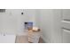 Practical laundry area with a basket and built in ironing board niche and outlet at 994 Lido Dr, Howey In The Hills, FL 34737