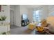 Cozy living room with plush seating, modern decor, and a sunlit window at 994 Lido Dr, Howey In The Hills, FL 34737