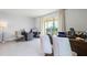 Bright home office with two workstations and a sliding glass door to the outside at 994 Lido Dr, Howey In The Hills, FL 34737
