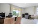 Office featuring dual desks, comfortable seating, and a large window providing a scenic view at 994 Lido Dr, Howey In The Hills, FL 34737