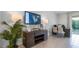 Bright office featuring stylish lamps, modern furniture, and a wall-mounted screen showing a community map at 994 Lido Dr, Howey In The Hills, FL 34737