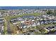 Aerial view of a home in a neighborhood featuring manicured lawns and is situated near a picturesque lake at 1073 Sadler Oaks Way, Winter Garden, FL 34787