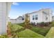 Landscaped backyard featuring a white picket fence and lush green lawn at 1073 Sadler Oaks Way, Winter Garden, FL 34787