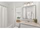 Bright white bathroom with granite countertop and shower/tub combination at 1073 Sadler Oaks Way, Winter Garden, FL 34787