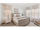 Bright bedroom with a tray ceiling, neutral color palette and natural light at 1073 Sadler Oaks Way, Winter Garden, FL 34787