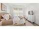 Comfortable bedroom with a bed, a TV atop a dresser, and soft neutral colors at 1073 Sadler Oaks Way, Winter Garden, FL 34787