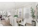 Elegant dining area with a wooden table, comfortable seating, and large windows providing natural light at 1073 Sadler Oaks Way, Winter Garden, FL 34787