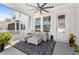 Covered patio featuring a ceiling fan, outdoor seating, and stylish rug, perfect for relaxing at 1073 Sadler Oaks Way, Winter Garden, FL 34787