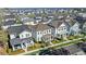 An aerial view of a neighborhood featuring houses with well-maintained lawns and landscaping at 1073 Sadler Oaks Way, Winter Garden, FL 34787