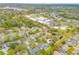 A residential neighborhood viewed from above shows a community near lakes and green spaces at 1145 Lake Rogers Cir, Oviedo, FL 32765