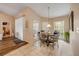 Dining area with decorative windows and a view of the side yard at 1145 Lake Rogers Cir, Oviedo, FL 32765