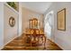 Bright dining room featuring hardwood floors, a wooden table, and natural light from the large window at 1145 Lake Rogers Cir, Oviedo, FL 32765