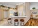 Modern kitchen featuring a breakfast bar with seating and updated appliances at 1145 Lake Rogers Cir, Oviedo, FL 32765