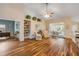 Bright living room with hardwood floors, high ceilings, and access to the lanai at 1145 Lake Rogers Cir, Oviedo, FL 32765