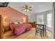 Comfortable main bedroom with warm colors, wood flooring, and a ceiling fan at 1145 Lake Rogers Cir, Oviedo, FL 32765