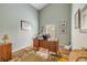 Spacious home office with a large desk, hardwood floors, and ample natural light at 1145 Lake Rogers Cir, Oviedo, FL 32765