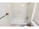 A clean bathroom featuring a white tub-shower, white subway tile, and modern fixtures at 1168 Ballyshannon Pkwy, Orlando, FL 32828