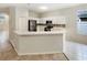 Modern kitchen with stainless steel appliances and white cabinetry at 1168 Ballyshannon Pkwy, Orlando, FL 32828