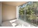 Screened in balcony with a view of trees and foliage at 13037 Mulberry Park Dr # 529, Orlando, FL 32821